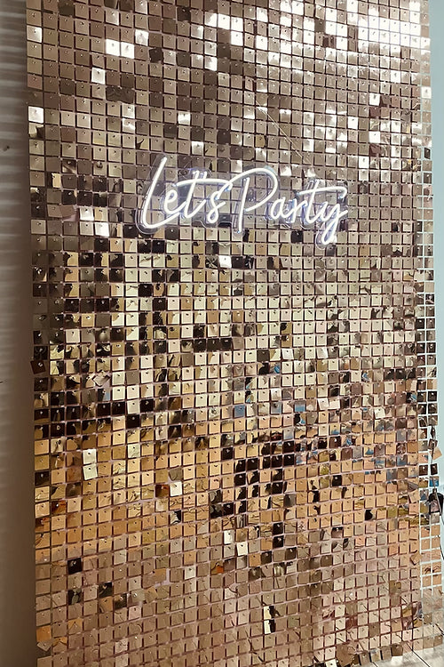 Rose gold Shimmer wall hire with neon signage