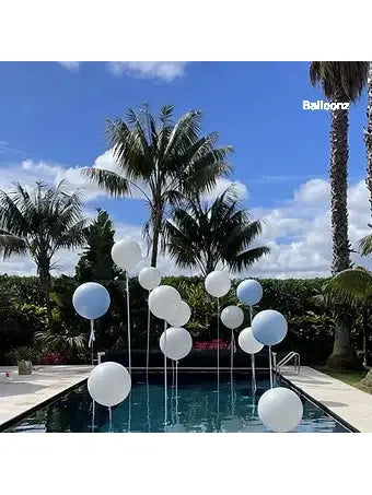 13 Jumbo balloons in a pool for party 