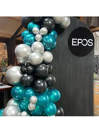 Black ripple arch and ballons and signage