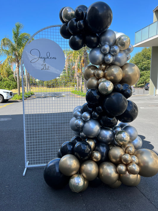 Black, gold and silver balloon garland and stand