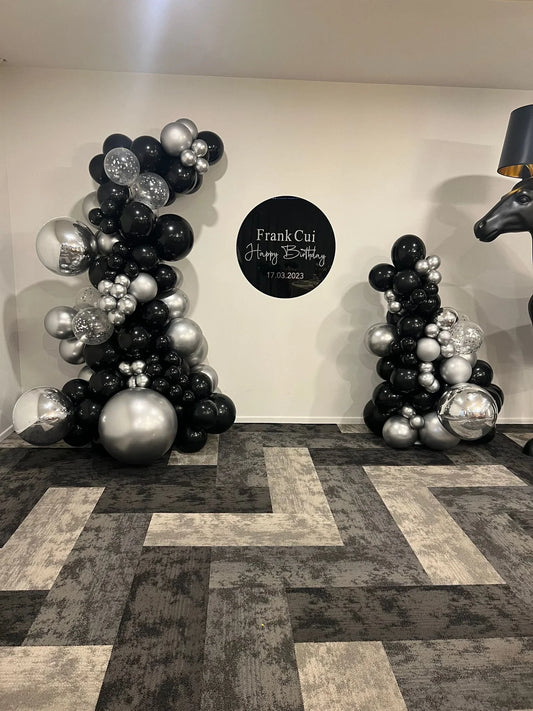 Black and silver inflated balloon garland and hire sign - Balloonz
