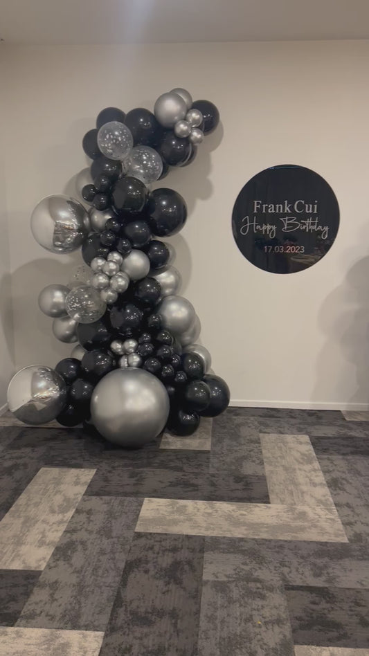 Black and silver inflated balloon garland and hire sign