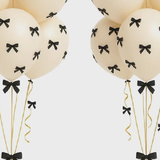 Retro white balloon bouquet with bows 
