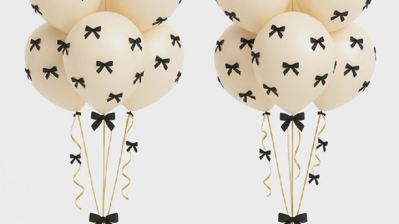 Retro white balloon bouquet with bows 