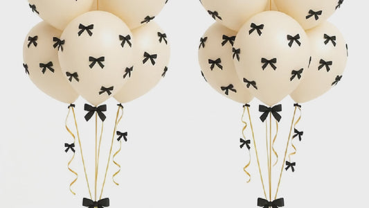 Retro white balloon bouquet with bows 